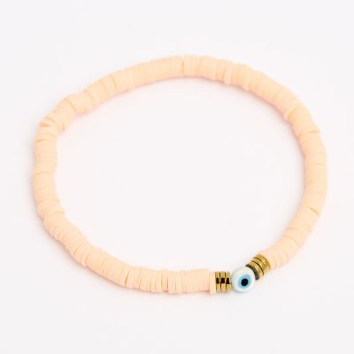 Bracelet acier dore élastique avec perles de heishi couleur corail pastel
